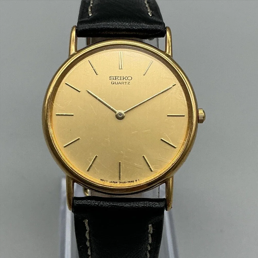 Vintage Seiko Mens Watch 31mm Gold Tone Black Leather 7N00-7A49 New Battery